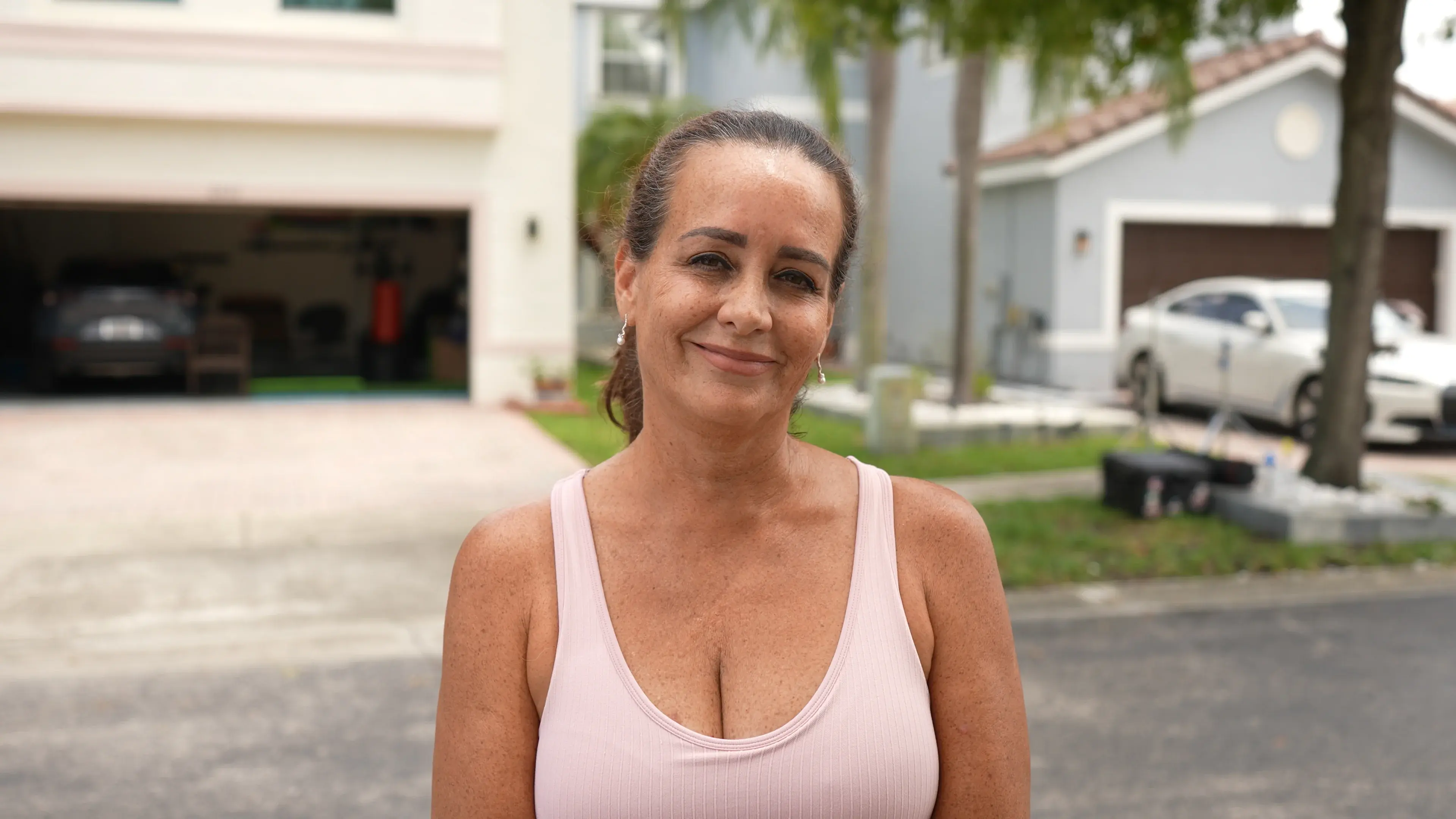 Customer testimonial video thumbnail - After seeing her neighbor's roof being repaired, she reached out to Blue Restoration. From the thorough inspection to the step-by-step process, she now has a brand new roof and couldn't be happier with the results.